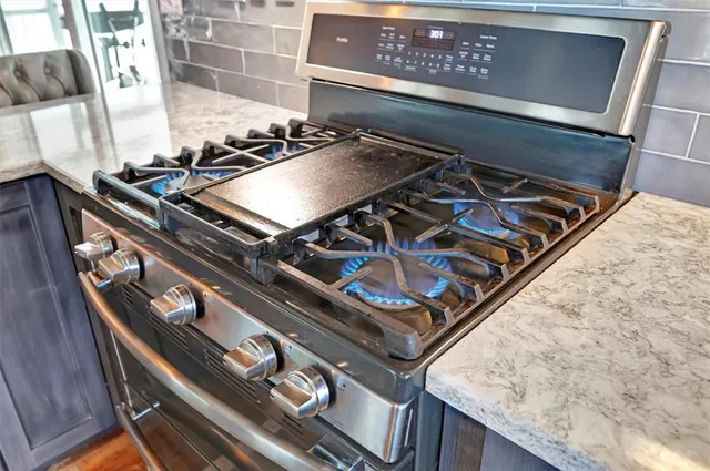 a bathroom with a sink double vanity granite and a large mirror