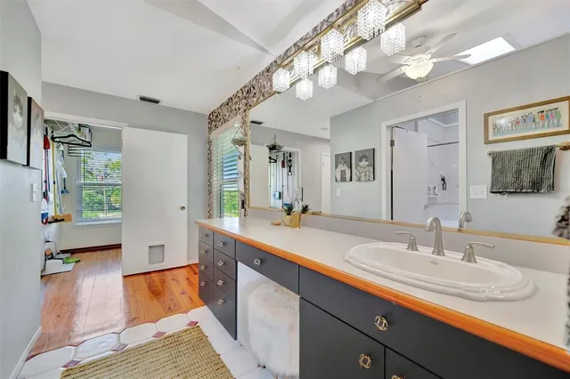 a bathroom with a sink double vanity and a mirror