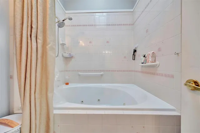 a balcony with wooden floor and outdoor seating