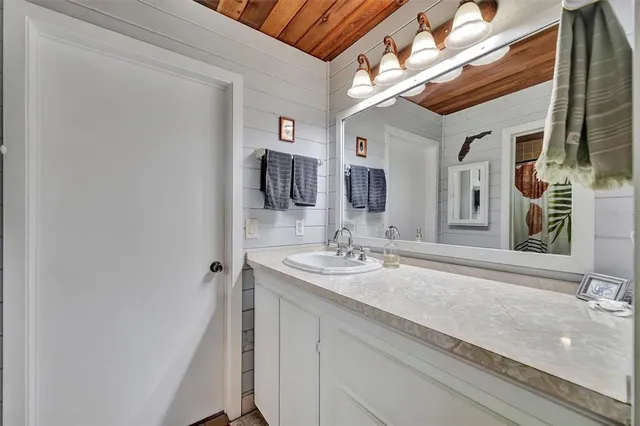 a view of a livingroom with furniture and a flat screen tv