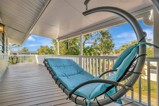 an aerial view of residential houses with outdoor space and swimming pool