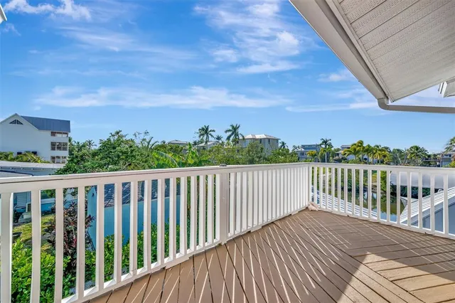 an aerial view of residential houses with outdoor space and swimming pool