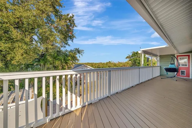 an aerial view of a house with yard swimming pool and outdoor seating