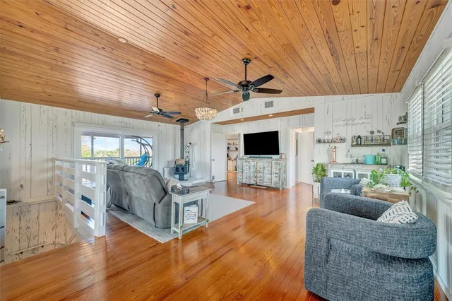 an aerial view of residential houses with outdoor space and swimming pool
