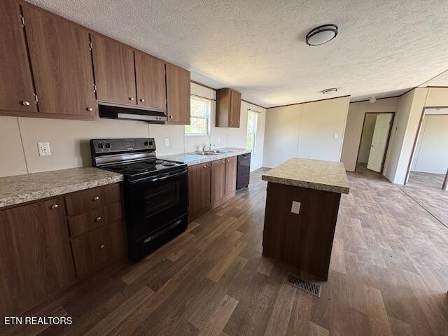 149 Powell Valley School Road Speedwell, TN 37870 - Photo 5 of 30 a kitchen with stainless steel appliances granite countertop a stove a sink and a refrigerator