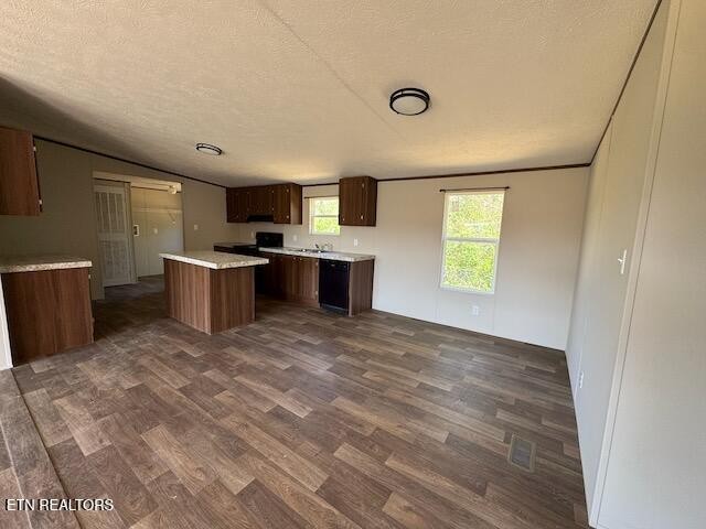 149 Powell Valley School Road Speedwell, TN 37870 - Photo 6 of 30 a view of a kitchen with a stove cabinets and a wooden floor