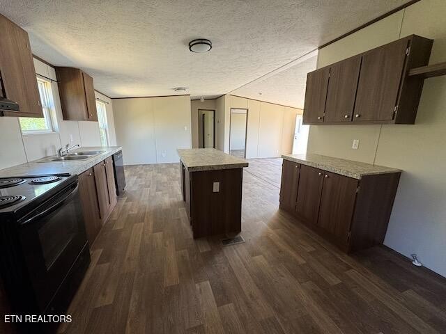149 Powell Valley School Road Speedwell, TN 37870 - Photo 7 of 30 a kitchen with stainless steel appliances granite countertop a stove a sink and a refrigerator