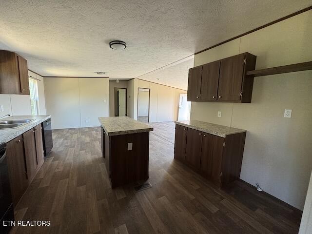 149 Powell Valley School Road Speedwell, TN 37870 - Photo 9 of 30 a kitchen with granite countertop a refrigerator a stove and wooden floors