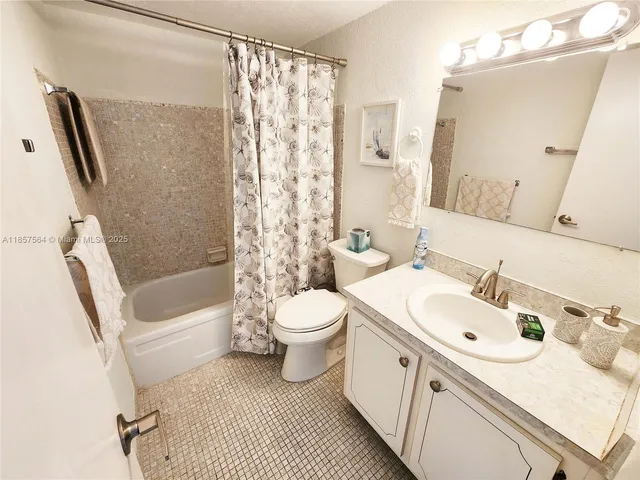 a bathroom with a sink a toilet and a bathtub