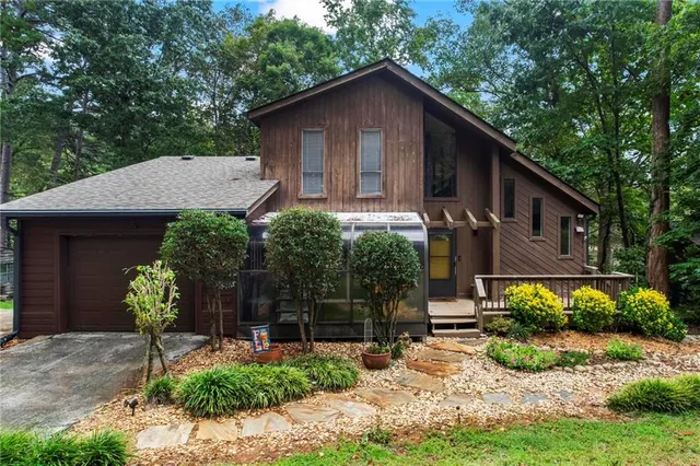 a front view of a house with garden