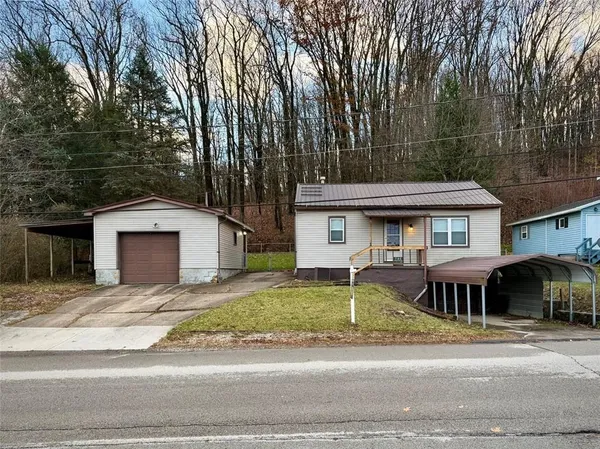 front view of a house with a yard