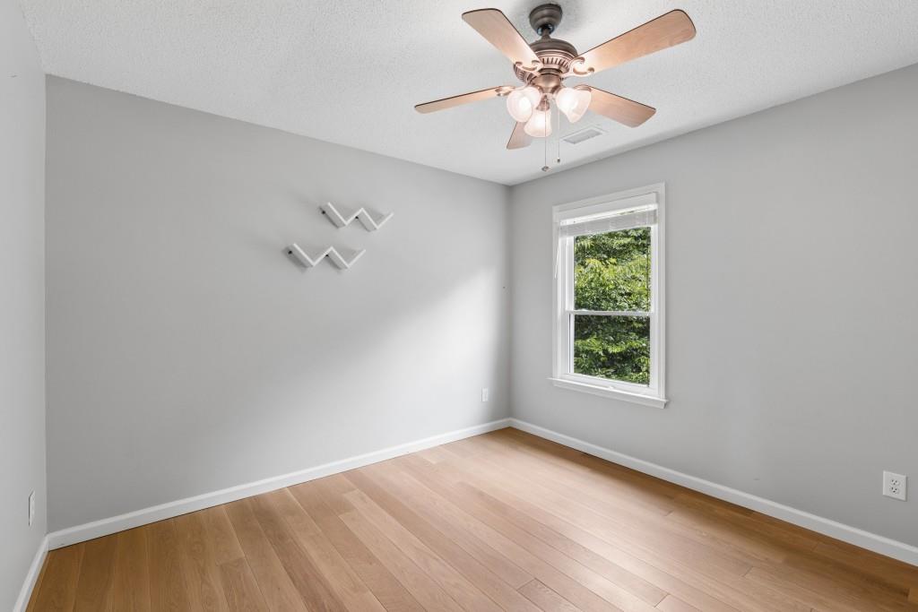 2120 Traywick Chase Alpharetta, GA 30004 - Photo 39 of 54 an empty room with a window and a fan