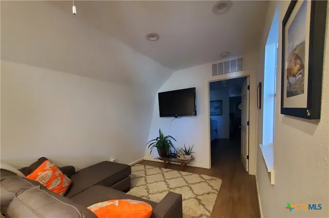 a bed room with a bed and a gym