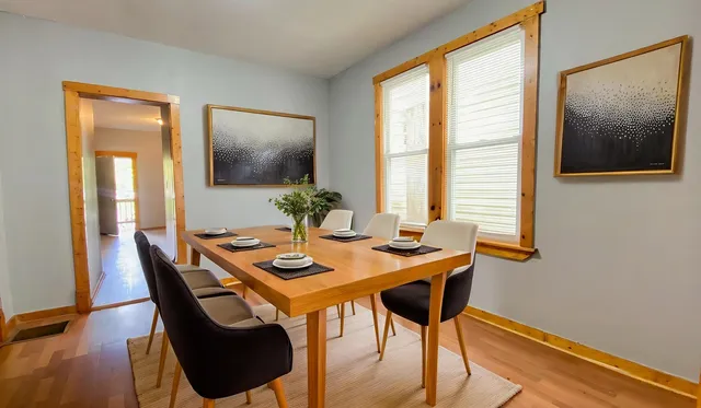 a dining room with furniture and window