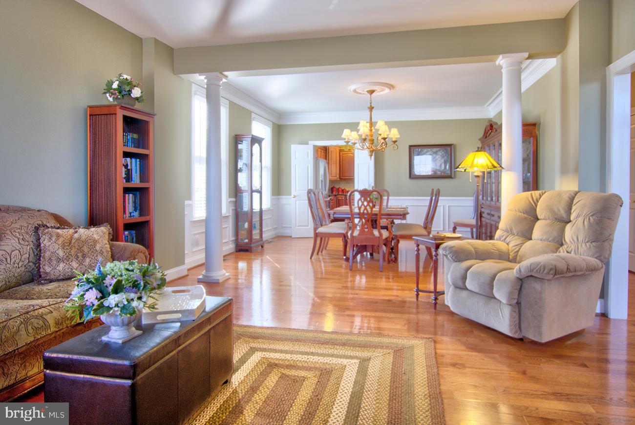816 Shadebrush Ridge Road West Chester, PA 19382 - Photo 12 of 44 a living room with furniture and a chandelier