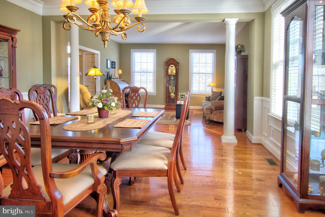816 Shadebrush Ridge Road West Chester, PA 19382 - Photo 15 of 44 a view of a dining room with furniture wooden floor and chandelier