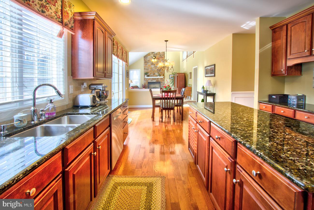 816 Shadebrush Ridge Road West Chester, PA 19382 - Photo 20 of 44 a view of a kitchen with kitchen island granite countertop a large window and sink