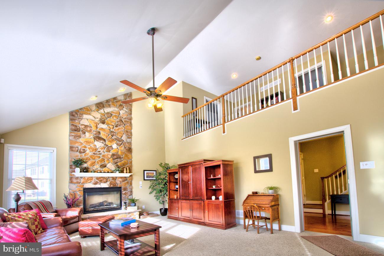 816 Shadebrush Ridge Road West Chester, PA 19382 - Photo 22 of 44 a living room with furniture a window and a ceiling fan