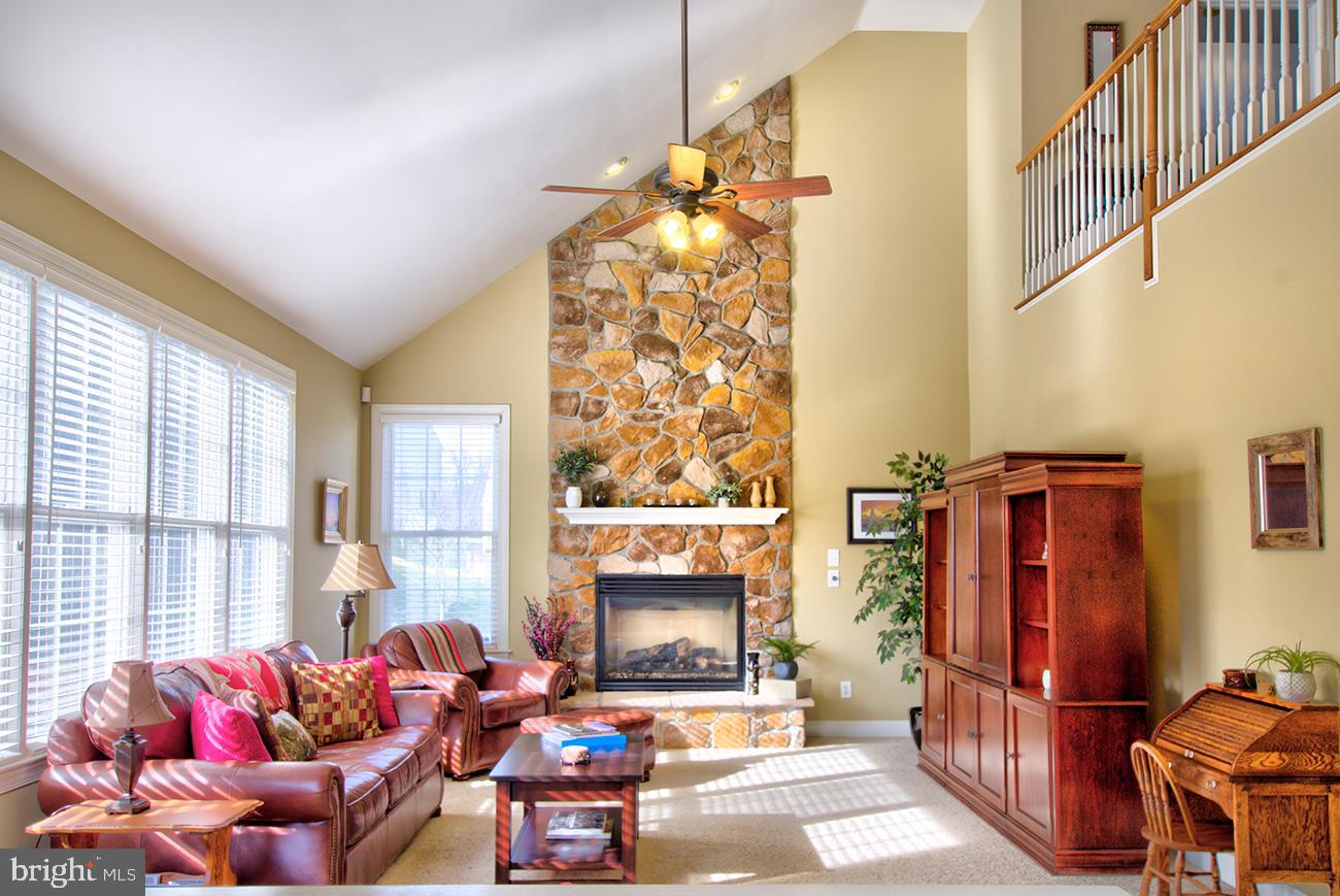 816 Shadebrush Ridge Road West Chester, PA 19382 - Photo 23 of 44 a living room with furniture a window and a fireplace