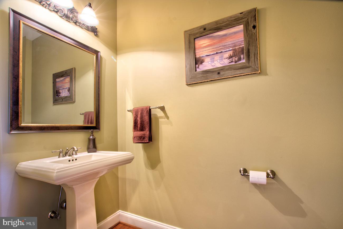 816 Shadebrush Ridge Road West Chester, PA 19382 - Photo 26 of 44 a bathroom with a sink mirror and toilet