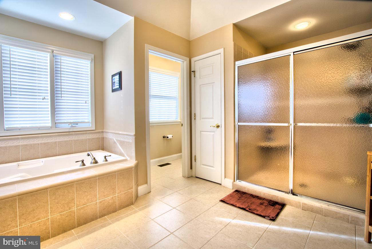 816 Shadebrush Ridge Road West Chester, PA 19382 - Photo 32 of 44 a bathroom with a tub shower and a bathtub