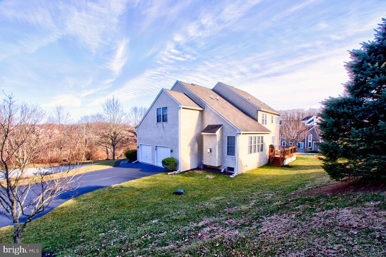 816 Shadebrush Ridge Road West Chester, PA 19382 - Photo 4 of 44 a front view of house with yard and trees in the background
