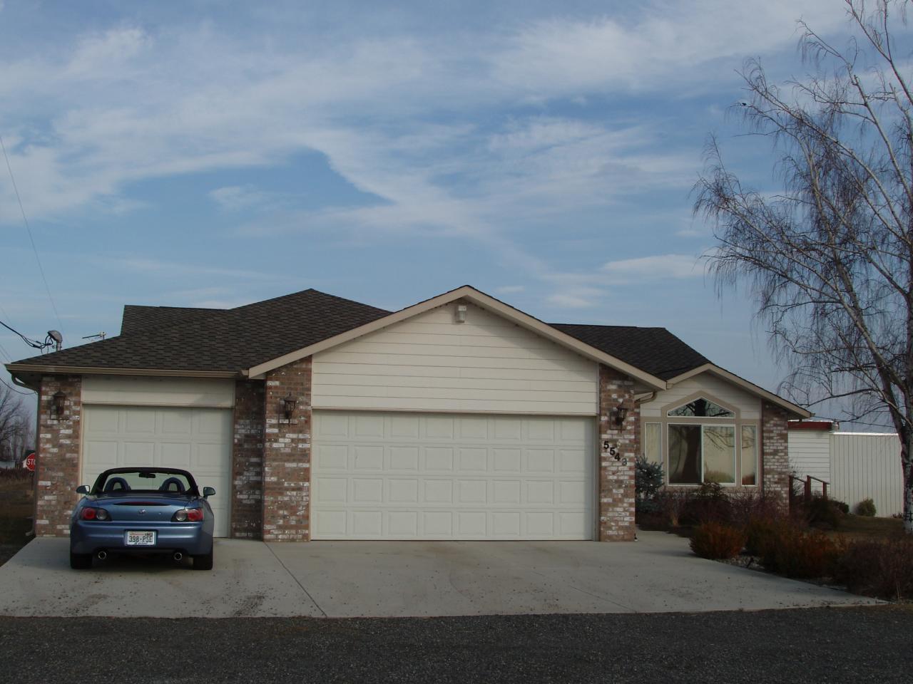 5543 Lateral A Road Wapato, WA 98951 - Photo 2 of 19 a car parked in front of a house