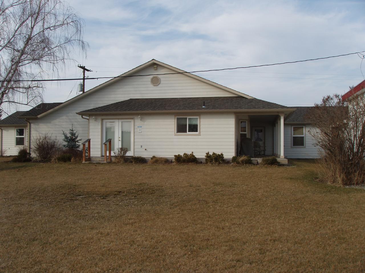 5543 Lateral A Road Wapato, WA 98951 - Photo 3 of 19 a front view of house with yard and trees