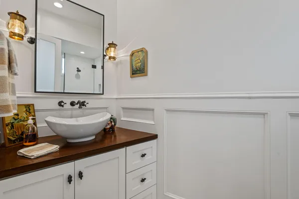 a bathroom with a sink and a mirror