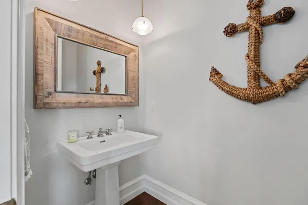 a bathroom with a sink and mirror