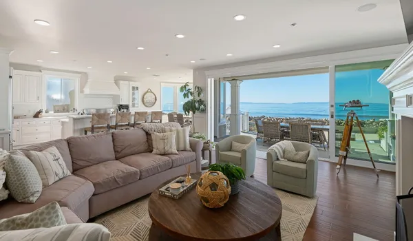 a living room with furniture fireplace and a table