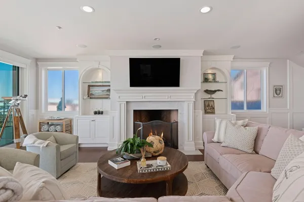 a living room with furniture and a fireplace