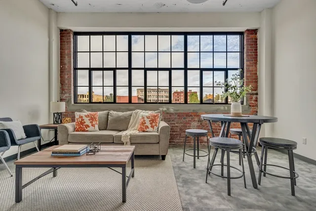 a living room with furniture and a window