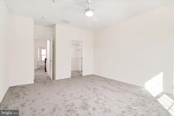 a view of a hallway with a white door