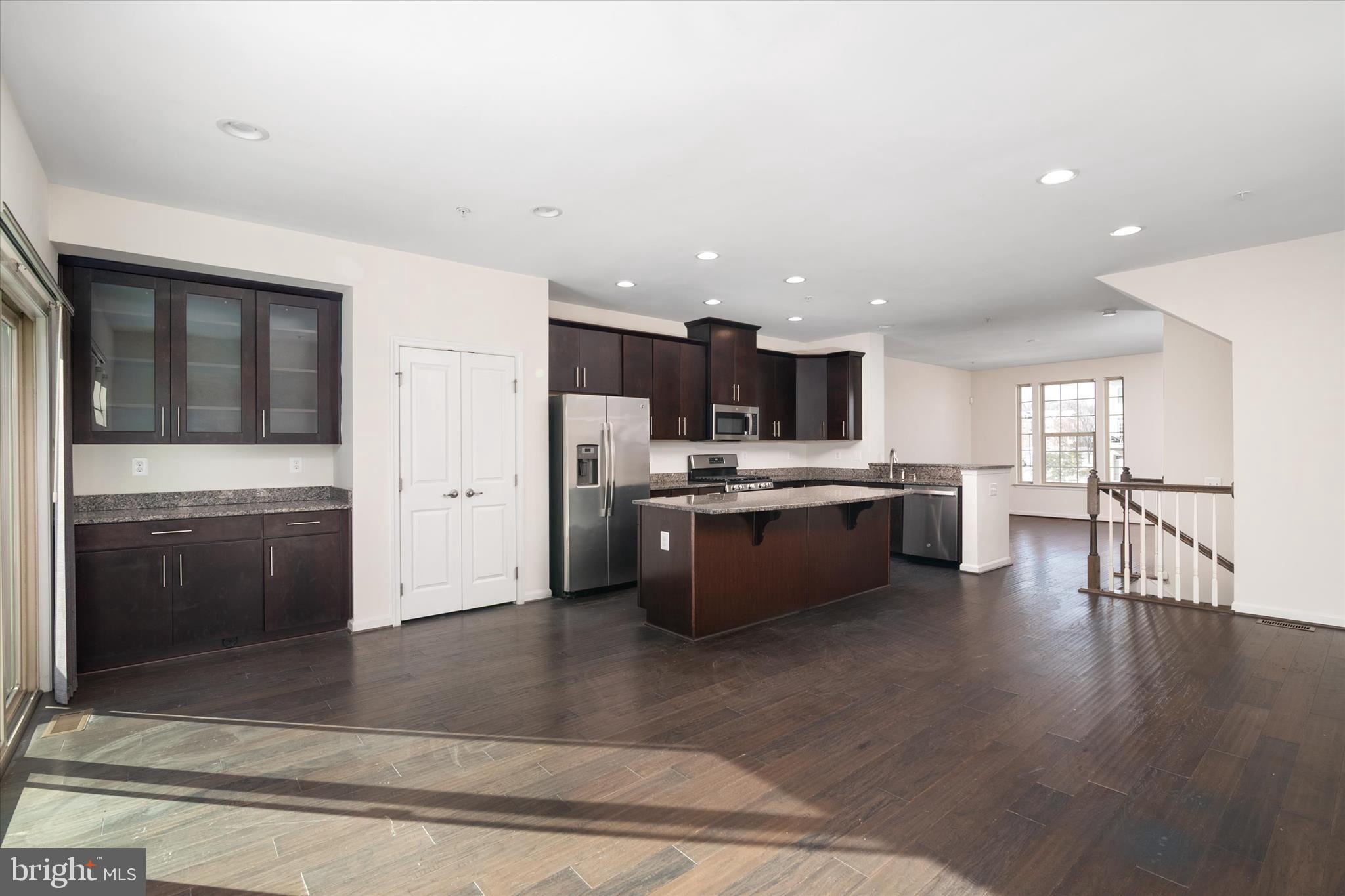 7627 Hamilton Crossing Hanover, MD 21076 - Photo 8 of 34 open kitchen with wet bar next to deck