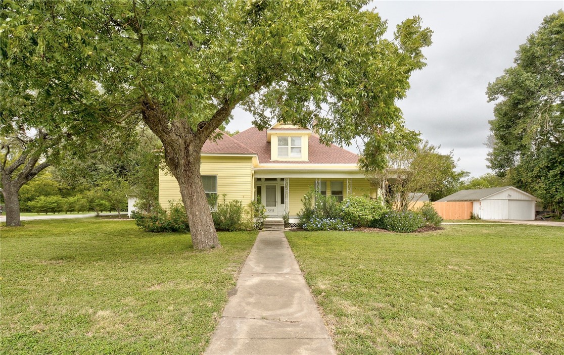 1303 West San Antonio Street Lockhart, TX 78644 - Photo 1 of 1 a front view of house with yard and green space