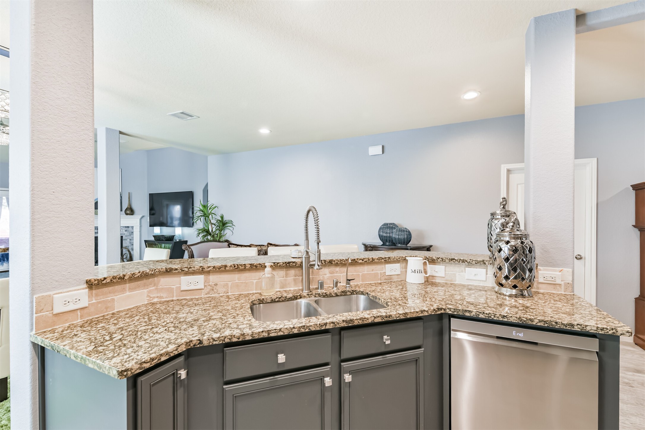 24047 Schults Meadow Lane Spring, TX 77389 - Photo 18 of 47 a kitchen with granite countertop a sink and cabinets