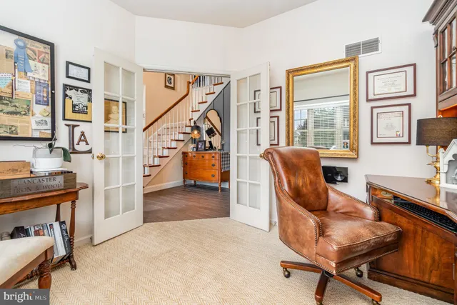 a view of living room kitchen with furniture and wooden floor