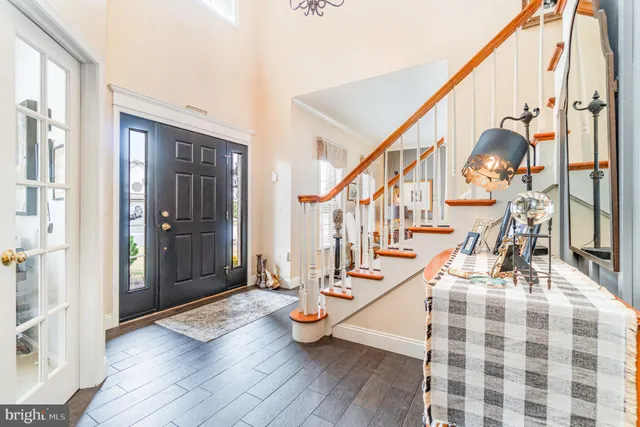 a bedroom with a bed table and a window
