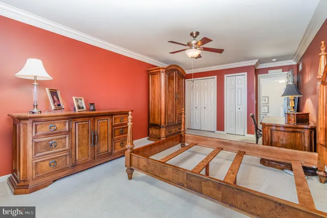 a view of a table and chairs under an umbrella in backyard