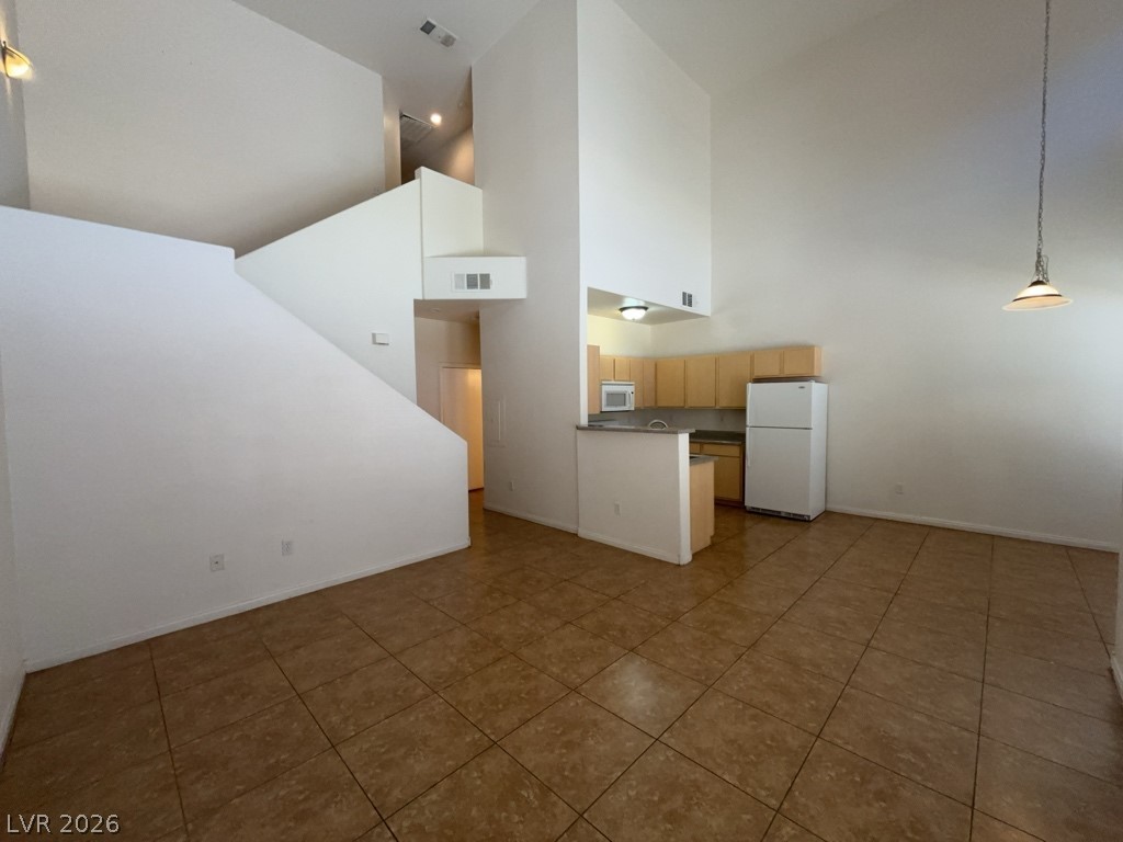 4915 East Russell Road, Unit 180 Las Vegas, NV 89120 - Photo 1 of 8 This bright, airy interior features an open concept kitchen and living space.