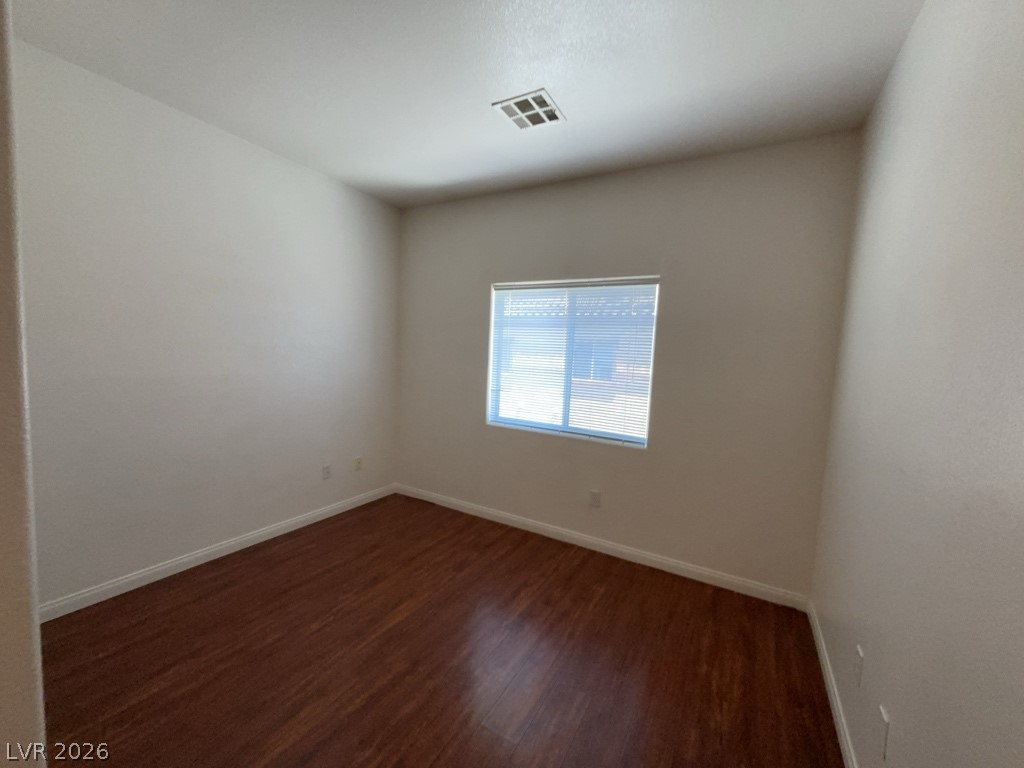 4915 East Russell Road, Unit 180 Las Vegas, NV 89120 - Photo 4 of 8 This versatile room features warm wood flooring and abundant natural light.