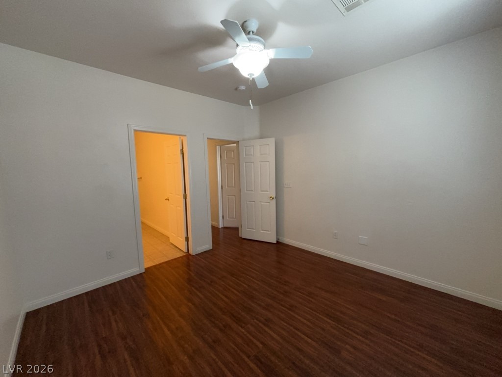 4915 East Russell Road, Unit 180 Las Vegas, NV 89120 - Photo 6 of 8 This spacious room features rich wood flooring and bright natural lighting.