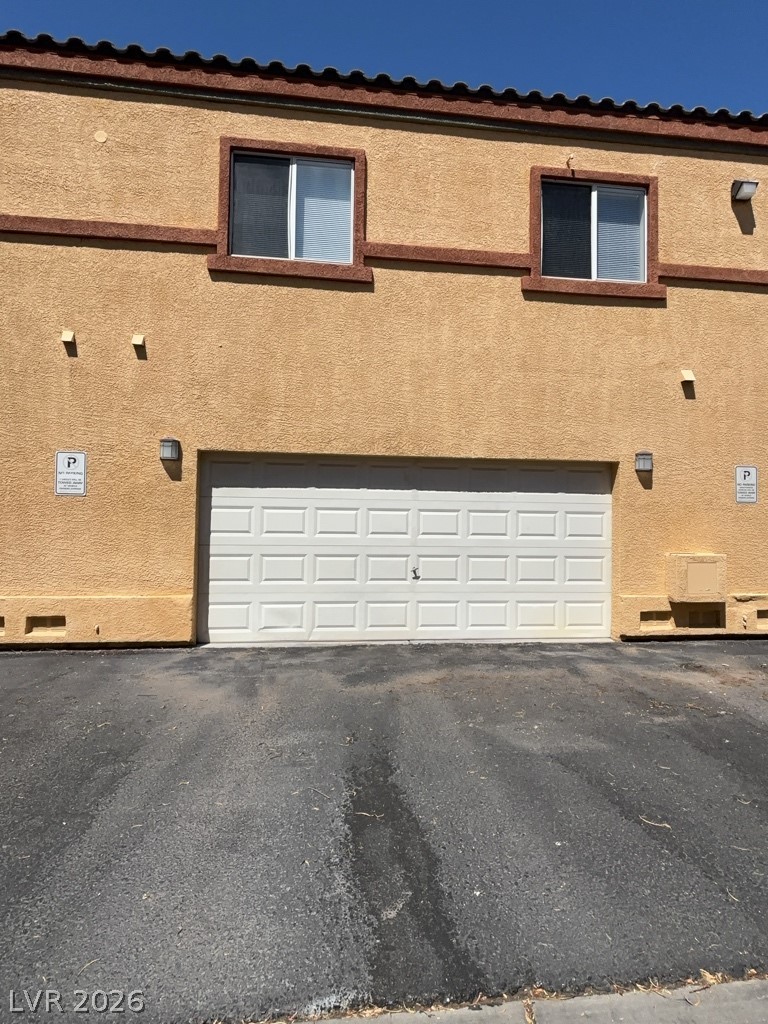 4915 East Russell Road, Unit 180 Las Vegas, NV 89120 - Photo 8 of 8 This residence features a convenient attached garage and classic stucco exterior.
