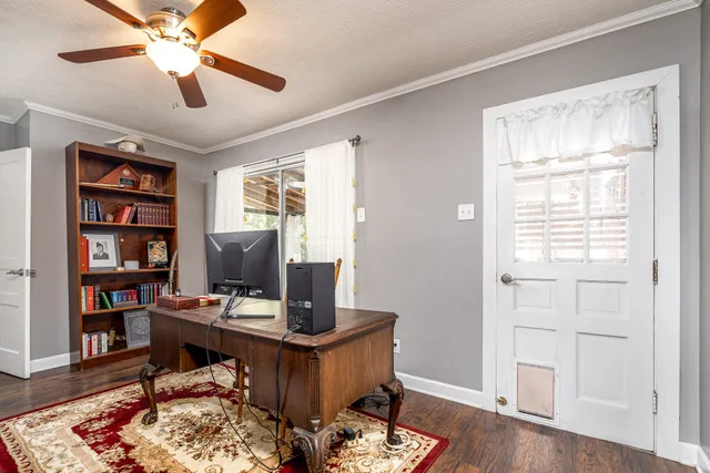 a workspace with furniture and a window