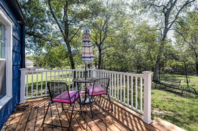a view of a two chairs in the deck