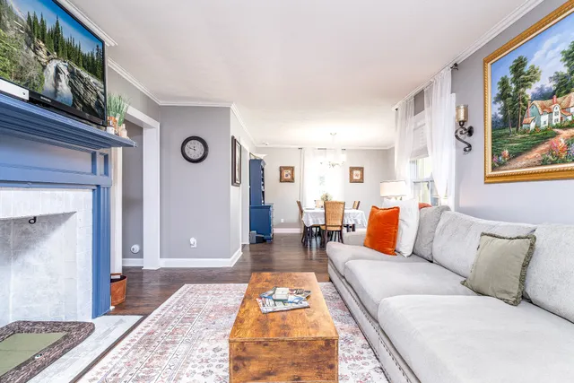 a living room with furniture and a rug