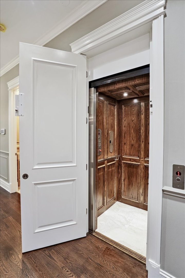 1445 West Wolfram Street Chicago, IL 60657 - Photo 11 of 69 a view of a hallway with wooden floor