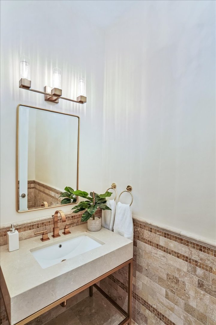 1445 West Wolfram Street Chicago, IL 60657 - Photo 12 of 69 a bathroom with a sink and a mirror