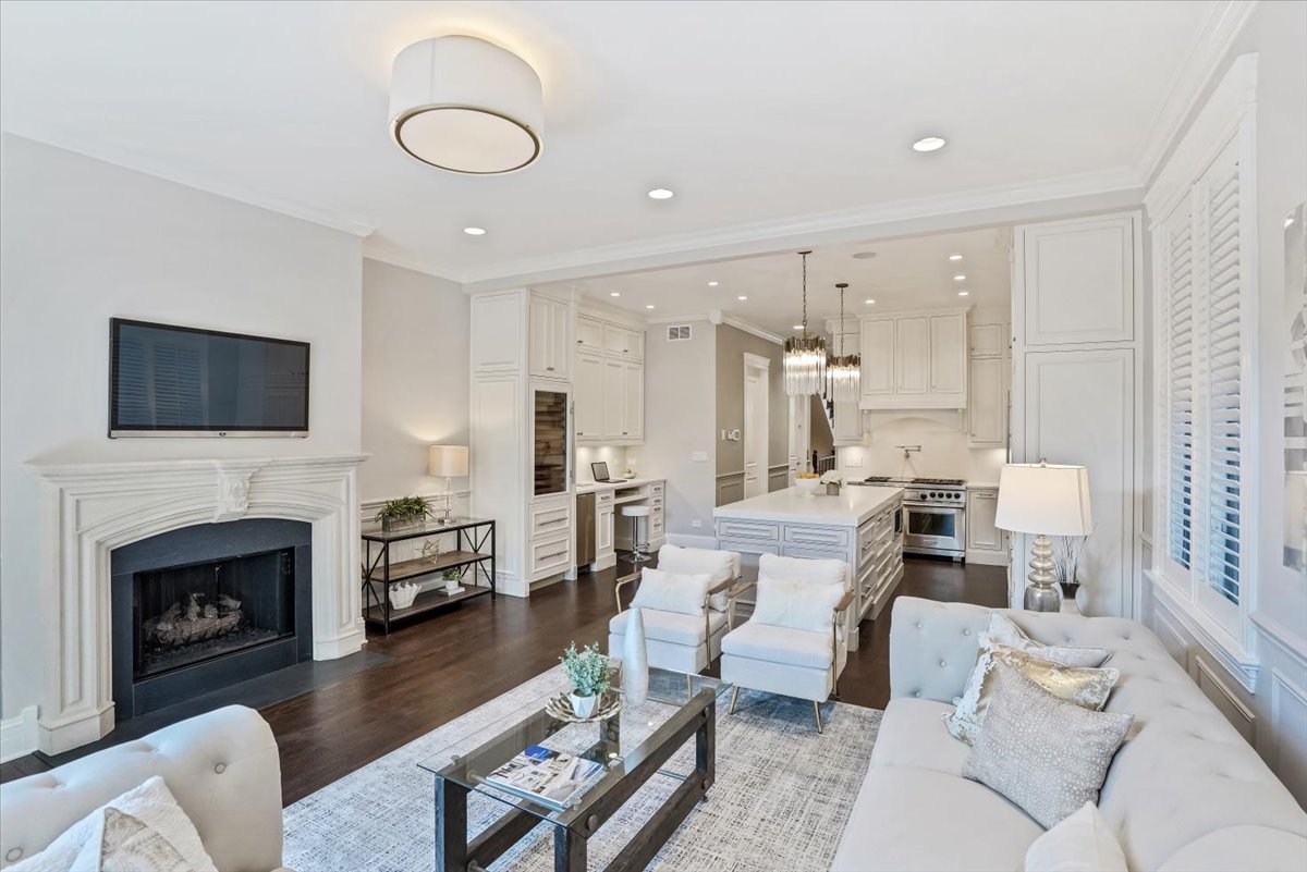 1445 West Wolfram Street Chicago, IL 60657 - Photo 23 of 69 a living room with furniture fireplace and a flat screen tv